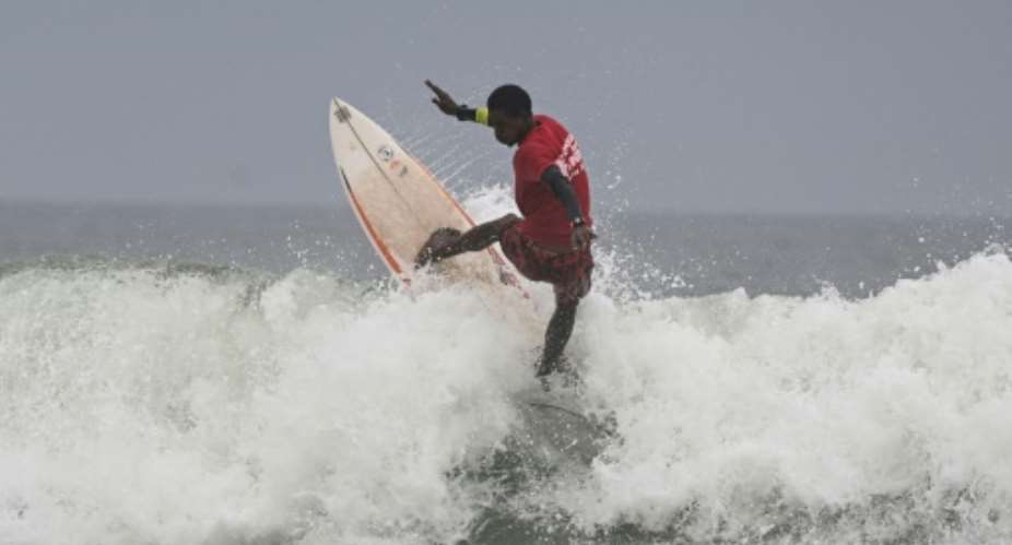 Ivory Coasts Souleymane Sidibe competed in his countrys first surfing competition.  By Issouf SANOGO (AFP)