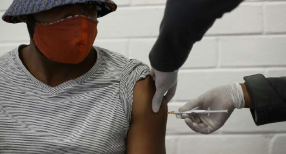Jab: A volunteer takes part in coronavirus vaccine trial in Soweto, South Africa, in January.  By SIPHIWE SIBEKO POOLAFPFile