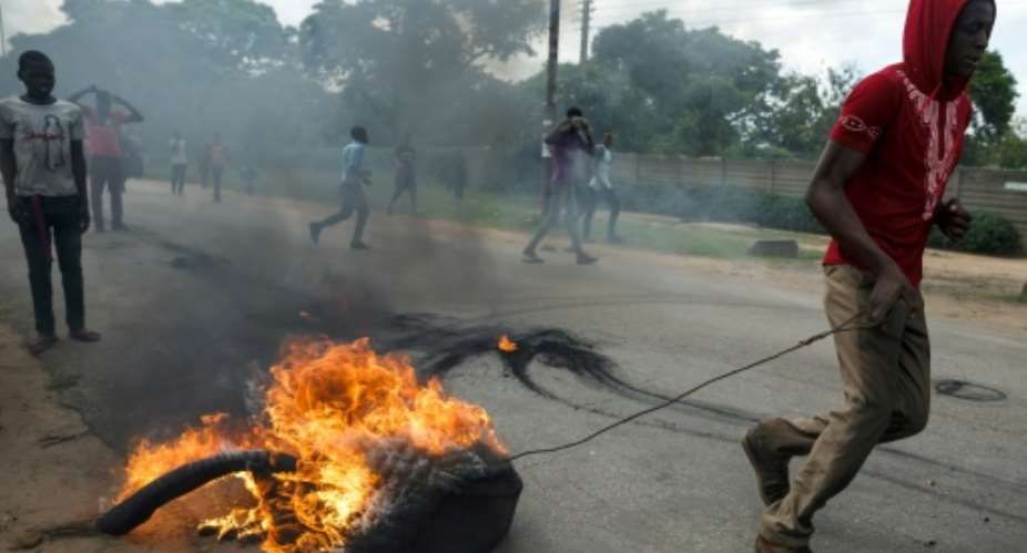 January 14 2019: Protests erupt in Harare over a fuel price hike.  By Jekesai NJIKIZANA AFP