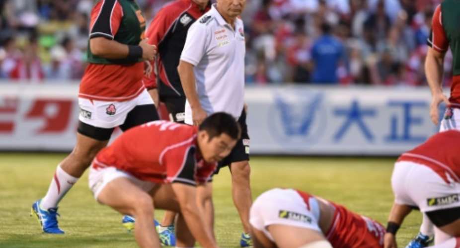 Japan's head coach Eddie Jones C watches as his side warms up prior to their friendly rugby union match against Uruguay in Tokyo on August 29, 2015.  By Kazuhiro Nogi AFPFile