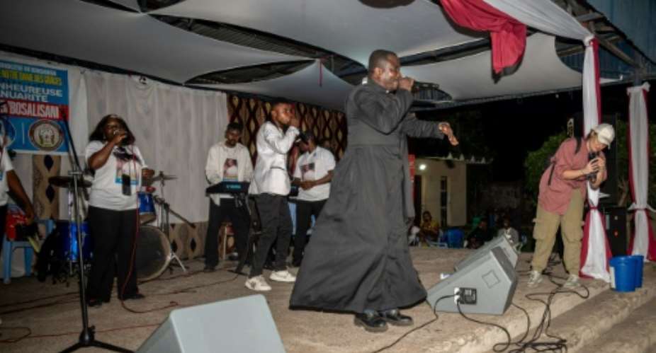 Jean-Pierre Mongambi, 47, is known as the rapping priest in Kinshasa.  By Hardy BOPE (AFP)
