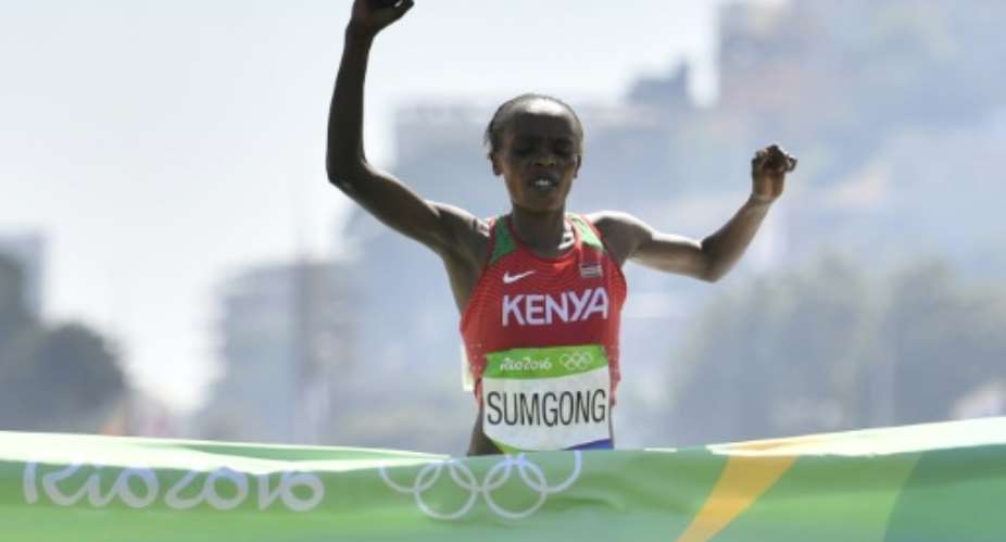 Jemima Sumgong was the first Kenyan woman to win Olympic marathon gold when she triumphed at Rio in 2016 and is also the regining London Marathon champion.  By Fabrice COFFRINI AFPFile