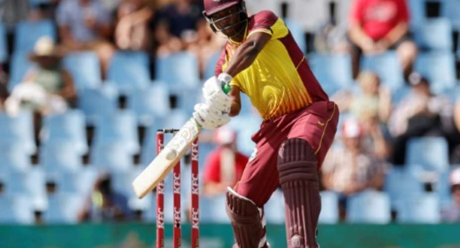 Johnson Charles hit 11 sixes and 10 fours in his 39-ball century for West Indies against South Africa.  By PHILL MAGAKOE AFP