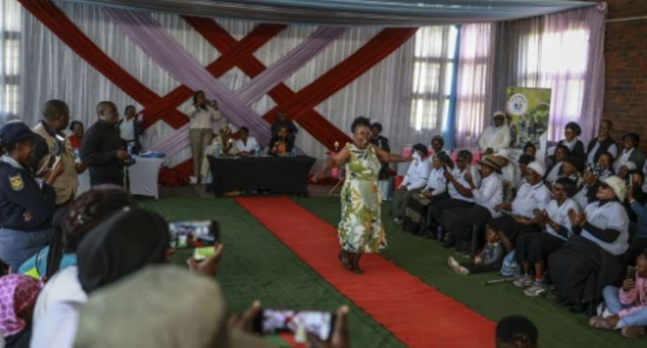 Joyce Malindi, 72, took part in the beauty pageant where grace and resilience took centre stage.  By Phill Magakoe (AFP)