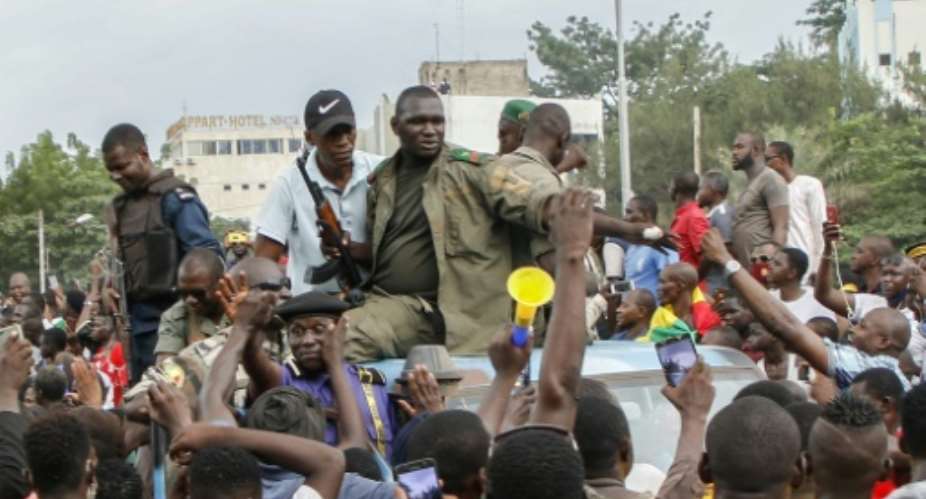 Jubilant crowds cheered the rebels as they arrived in central Bamkako on Tuesday.  By STRINGER AFP