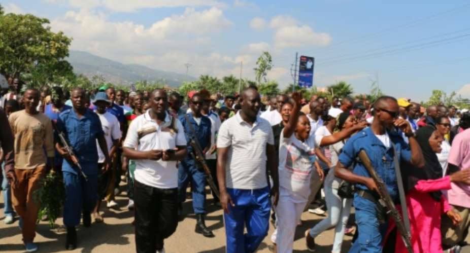 Demonstrators march during a rally in Bujumbura on May 14, 2016, commemorating the one-year anniversary of a failed attempt of a goverment coup.  By  AFPFile