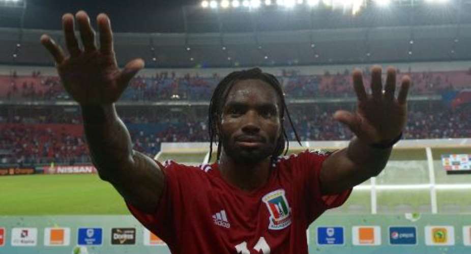 Equatorial Guinea's midfielder Javier Balboa celebrates his team's victory at the end of the 2015 African Cup of Nations match against Gabon in Bata, on January 25, 2015.  By Carl De Souza AFP