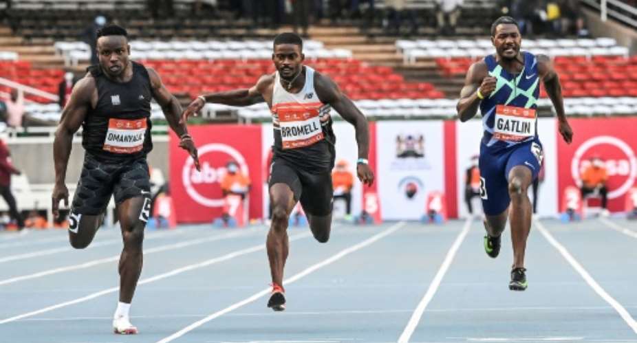 Justin Gatlin right could only finish third behind Trayvon Bromell centre and Ferdinand Omanyala left in the men's 100m race in Nairobi on Saturday.  By Simon MAINA AFP