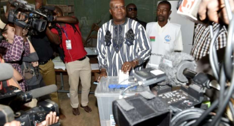 Burkina Faso's presidential candidate Roch Marc Christian Kabore, pictured casting his vote in Ouagadougou on November 29, 2015, won with 53.49 percent of ballots.  By Issouf Sanogo AFP