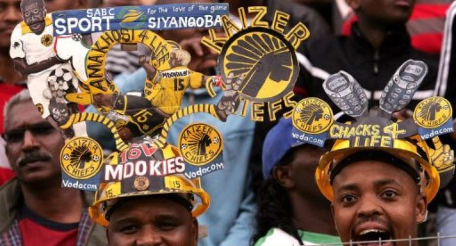 South African Kaizer Chiefs fans cheer at the Absa stadium, in Durban, on July 21, 2007.  By Alexander Joe (AFP/File)