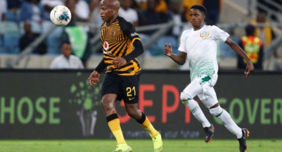 Kaizer Chiefs star Lebogang Manyama L is pursued by a Bloemfontein Celtic opponent during a South African Premiership match this season.  By Anesh DEBIKY AFP