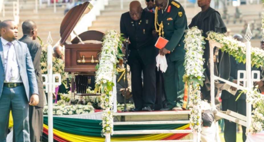 Kaunda being helped down steps in September 2019 at the funeral of Zimbabwean former president Robert Mugabe.  By Jekesai NJIKIZANA AFPFile