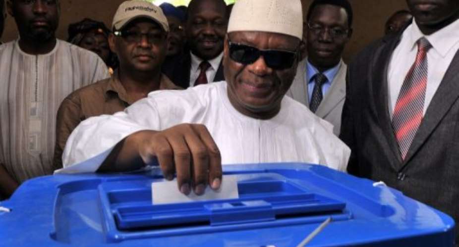 Ibrahim Boubacar Keita casts his vote at the polling station in Bamako on August 11, 2013.  By Issouf Sanogo AFPFile