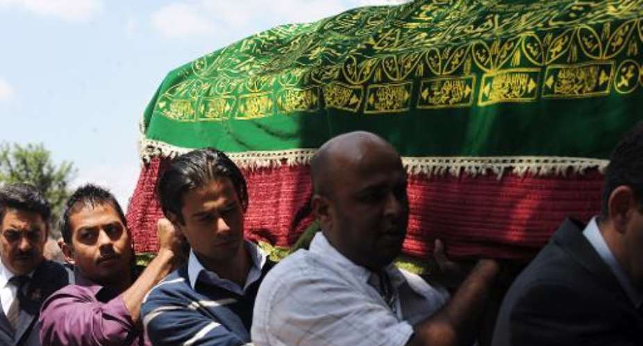 Mourners carry the coffin of Kenyan journalist Ruhila Adatia-Sood during a funeral ceremony in Nairobi, on September 26, 2013.  By Simon Maina (AFP Photo)