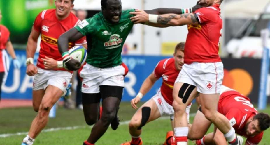 Kenya centre Collins Injera is tackled during the defeat to Canada in the World Cup qualifying tournament.  By GERARD JULIEN AFP
