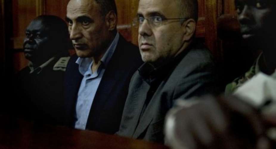 Sayed Mansour (second left) and Ahmed Mohammed appear in Nairobis high court on July 23, 2012.  By Tony Karumba (AFP/File)