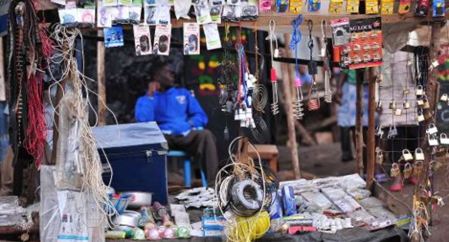 A Kenyan man sells electronics in the Kibera slum in Nairobi on November 14, 2014.  By Simon Maina AFPFile