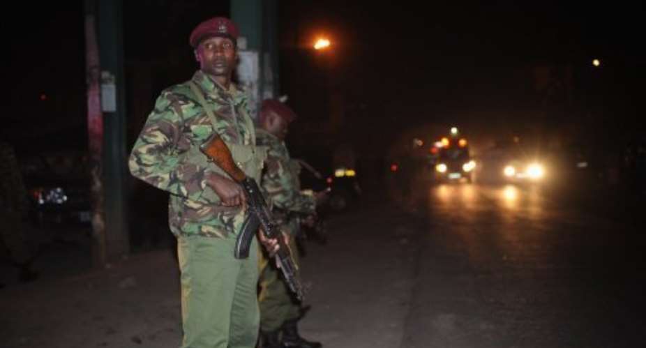Kenyan police secure the area of an attack at a bus station in Nairobi on March 10.  By Simon Maina (AFP/File)