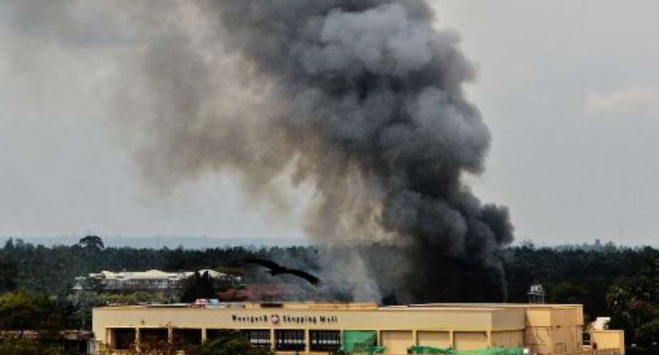 Smoke rises from the Westgate mall in Nairobi on September 23, 2013.  By Carl de Souza AFPFile