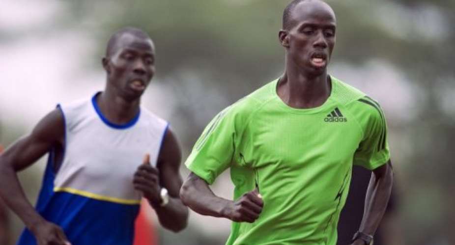 Brimin Kipruto (right) goes through the paces 2012 with compatriot African champion Abel Mutai.  By Tony Karumba (AFP)