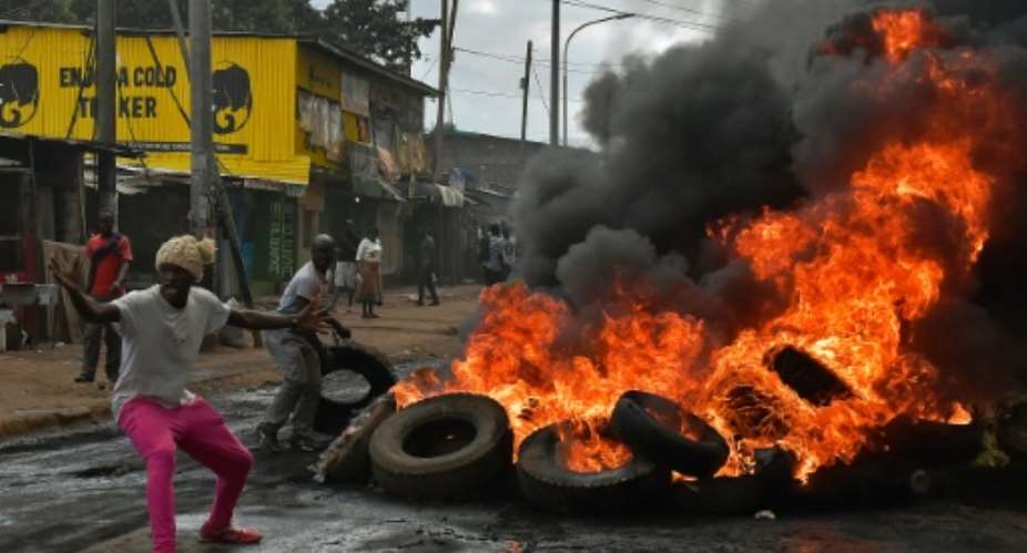 Kenyan tiot police used tear gas and water cannon to disperse protesters in the western town of Siaya Monday who also tried to gather in the capital Nairobi pictured.  By Carl de Souza AFP