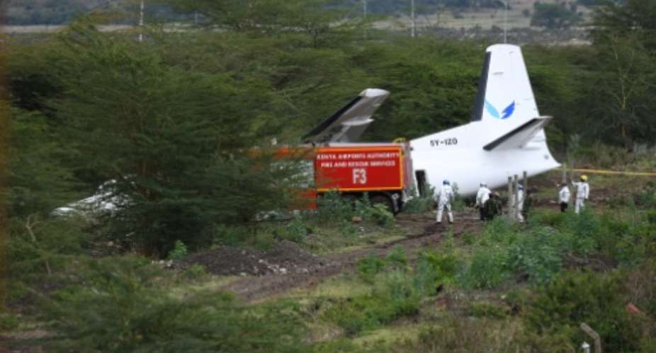 Kenyan Airports Authority firefighters respond to a Silverstone Air aircraft, with 50 passengers and 5 crew members on board, that overran the runway on takeoff at Wilson Airport, in Nairobi.  By SIMON MAINA AFP