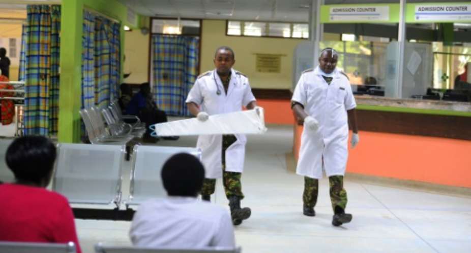 Kenyan Defence force doctors are seen inside Kenyatta National Hospital on December, 10,2016, in Nairobi.  By JOHN MUCHUCHA AFP