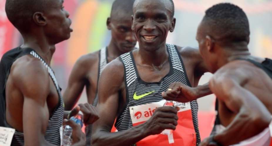 Kenyan Olympic gold medallist marathon runner Eliud Kipchoge C is one of three top runners selected by Nike to make the marathon record attempt later this year.  By Sajjad Hussain AFPFile