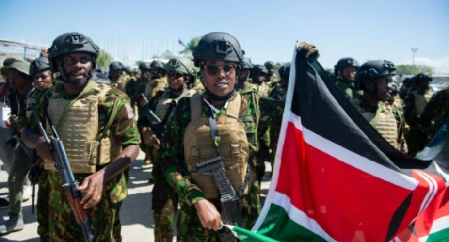 Kenyan police officers arrive at Toussaint Louverture International Airport in Port-au-Prince.  By Clarens SIFFROY (AFP)
