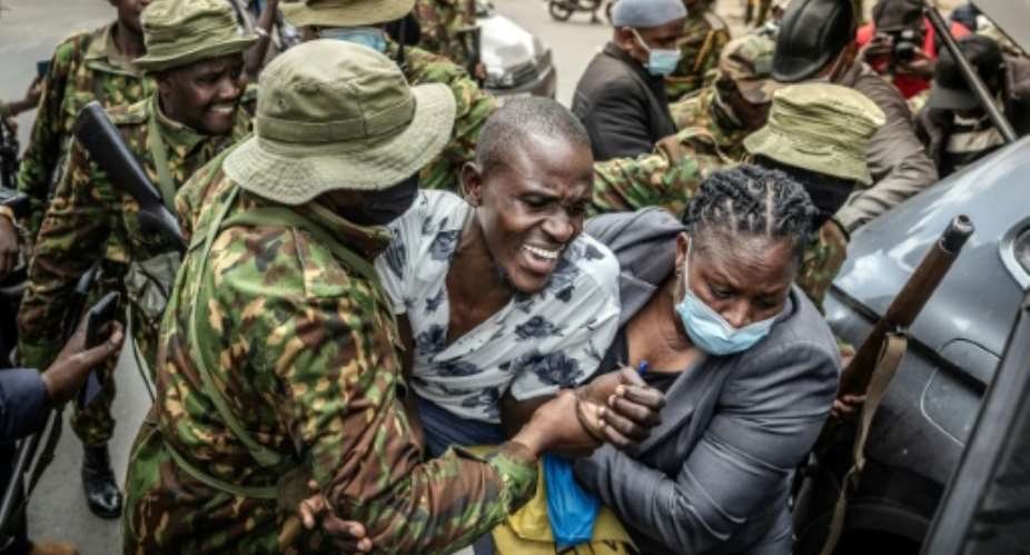 Kenyan police swarmed on a tiny group trying to protest.  By Luis TATO (AFP)
