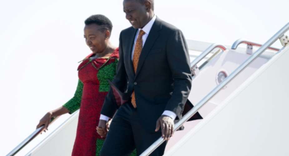 Kenyan President William Ruto and his wife, First Lady Rachel Ruto, disembark from their airplane on arrival in Washington.  By SAUL LOEB (AFP)