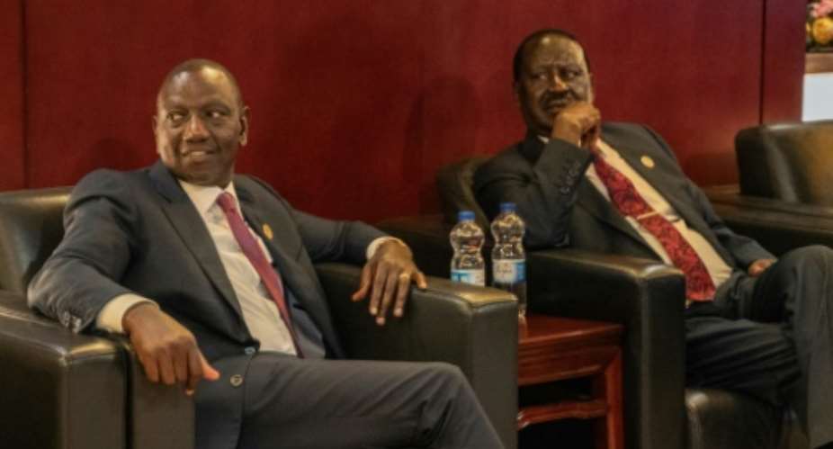Kenyan President William Ruto (L) and opposition veteran Raila Odinga signed a deal to help ease the prevailing tension in the country.  By Amanuel Sileshi (AFP)