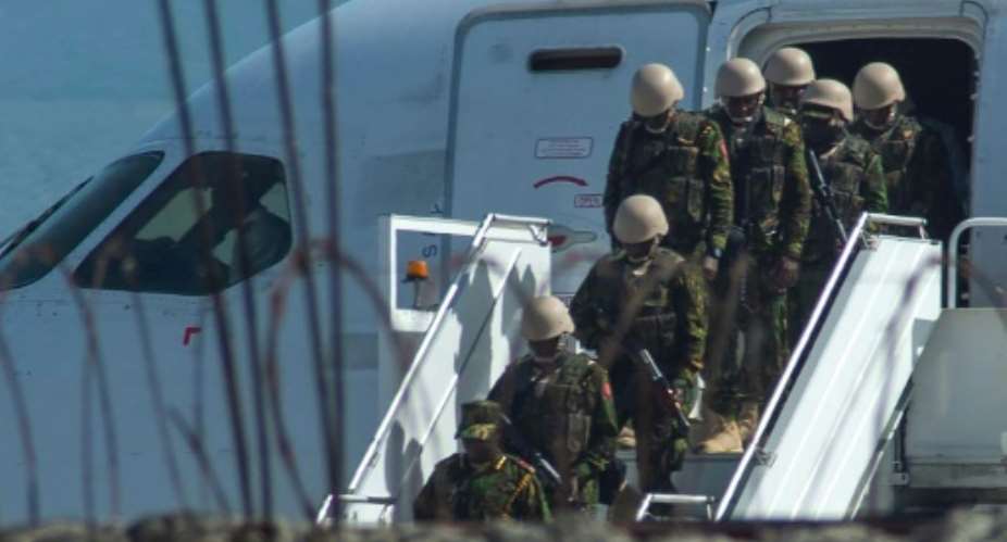 Kenyan security forces arrive at Toussaint Louverture International Airport in Port-au-Prince.  By Clarens SIFFROY (AFP)