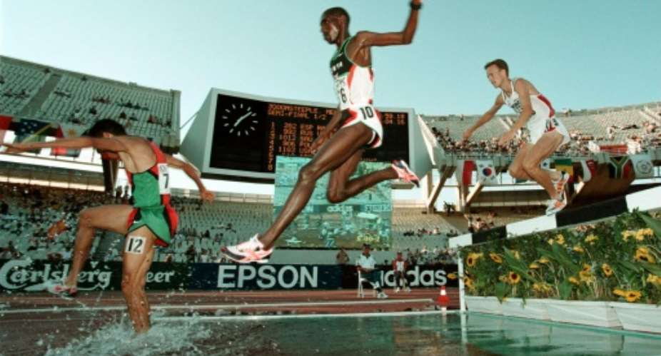 Moses Kiptanui centre of Kenya in action at the 1997 world athletics championships in Athens.  By Eric Feferberg AFPFile