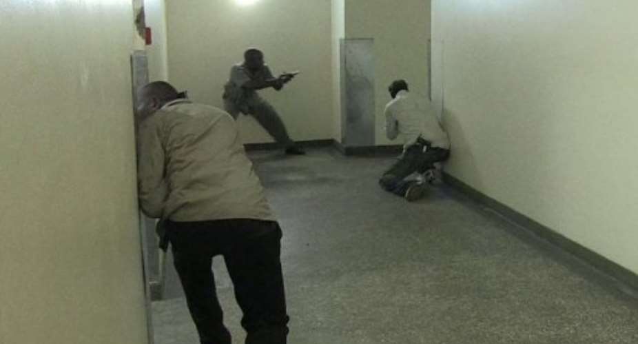Image from AFPTV shows Kenyan security forces inside a shopping mall following an attack in Nairobi, September 21, 2013.  By Nichole Sobecki (AFPTV)