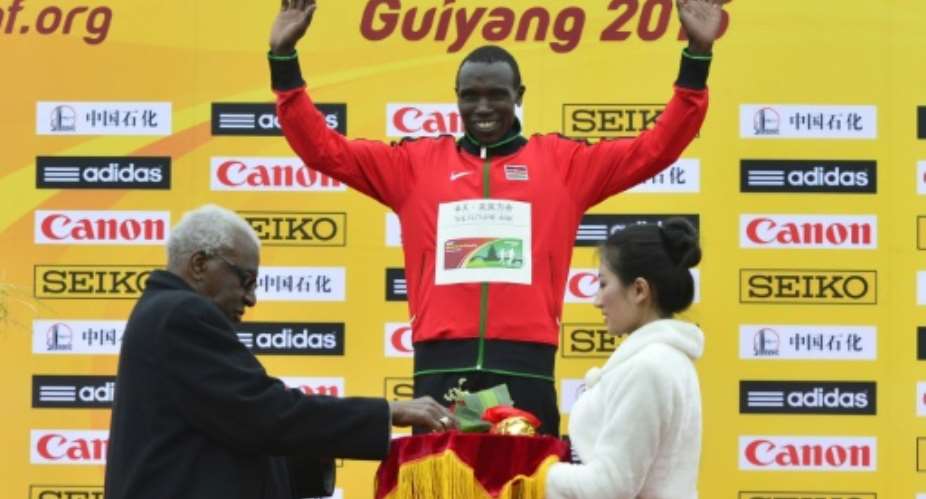 Kenya's Geoffrey Kipsang Kamworor celebrates winning the senior event at the IAAF World Cross Country Championships in Guiyang, southwest China's Guizhou province on March 28, 2015.  By  AFPFile