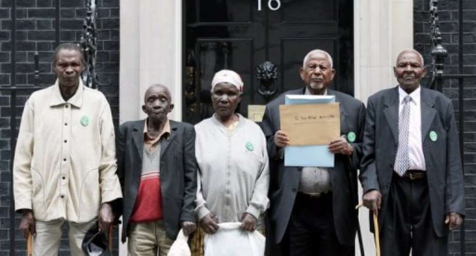 Kenyan Mau Mau War veterans stand in Downing Street in central London.  By Shaun Curry AFPFile