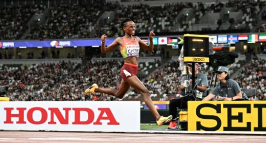 Kenyas Beatrice Chebet celebrates after winning the world 10,000m title.  By Jewel SAMAD (AFP)