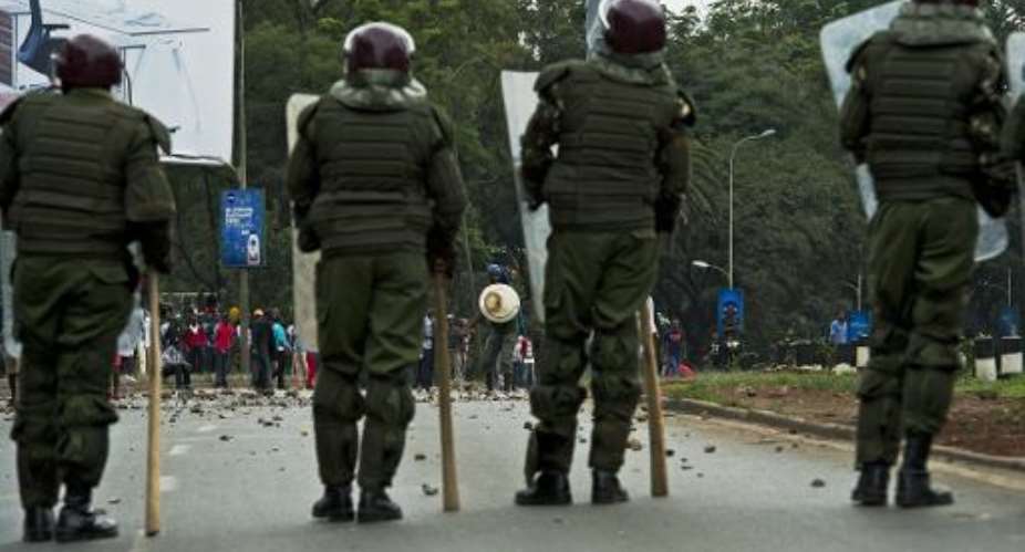 Kenyan riot police stand guard in Nairobi on May 20, 2014.  By Carl de Souza AFPFile