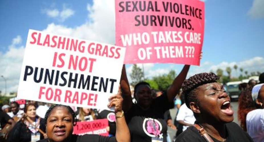 Kenyan protestors march on October 31, 2013 in Nairobi demanding justice after men accused of brutally gang raping a schoolgirl cut grass as punishment.  By Simon Maina AFPFile
