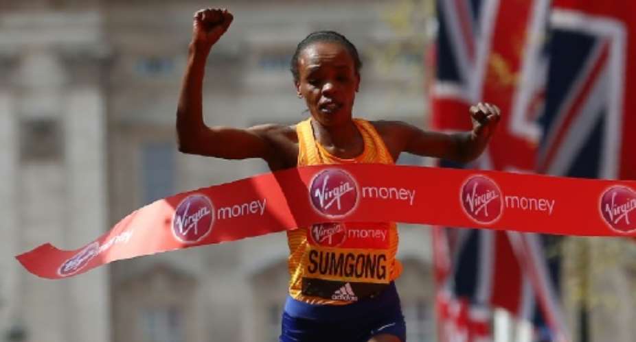 Kenya's Jemima Sumgong crosses the finish line to win the 2016 London Marathon.  By JUSTIN TALLIS AFP