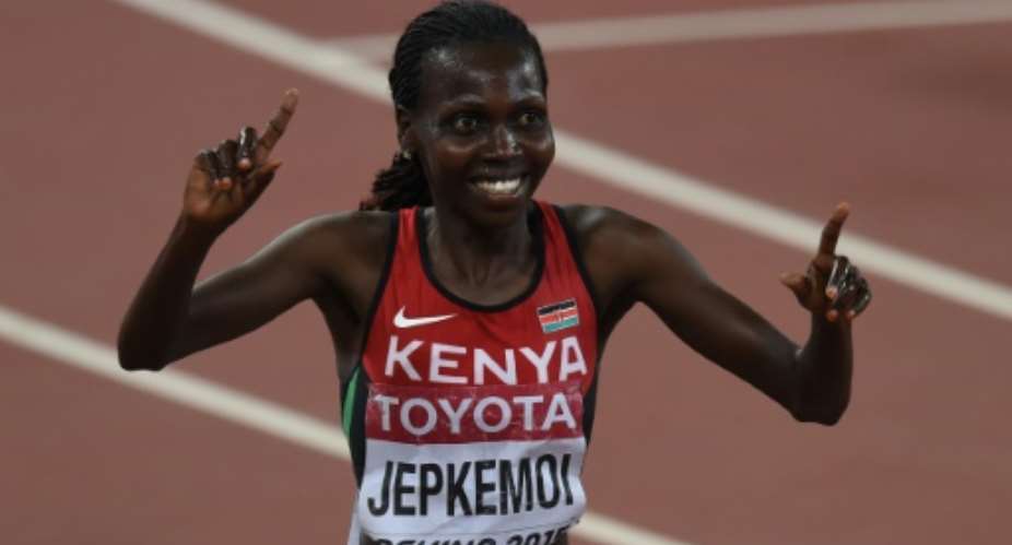 Hyvin Kiyeng Jepkemoi celebrates victory in the women's 3000 metres steeplechase at the IAAF World Championships in Beijing on August 26, 2015.  By Pedro Ugarte AFP