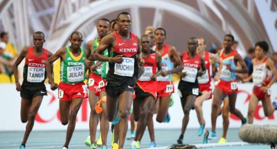 Kenya's Bedan Karoki Muchiri leads during the men's 10,000 metres final at the 2013 IAAF World Championships at the Luzhniki stadium in Moscow on August 10, 2013.  By Alexander Nemenov AFPFile