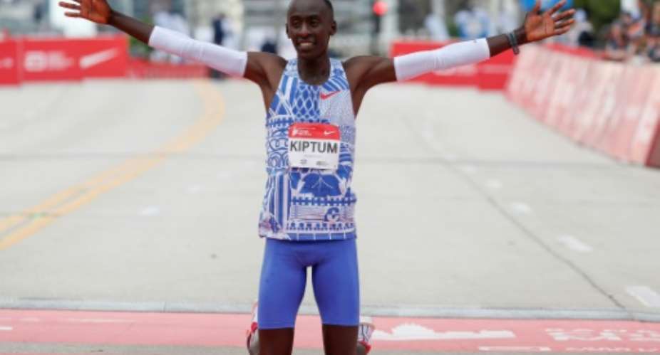 Kenyas Kelvin Kiptum won the 2023 Chicago Marathon in a world record time of 2:00.35.  By KAMIL KRZACZYNSKI (AFP)
