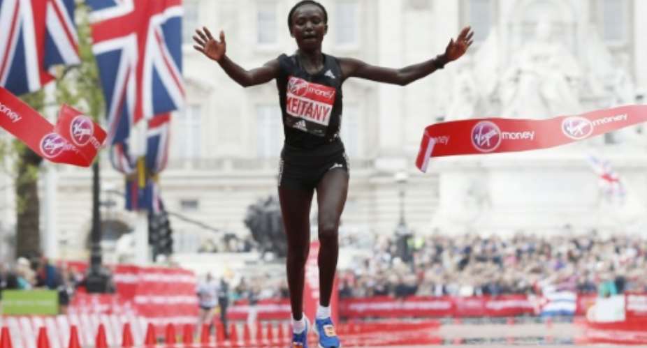 Kenya's Mary Keitany wins the London Marathon with an unofficial time of 2hrs 17min 01sec.  By Adrian DENNIS AFP