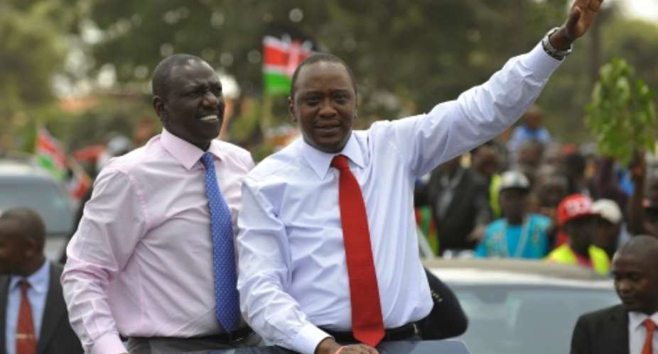 William Ruto left with Kenya's President Uhuru Kenyatta on October 9, 2014 in Nairobi.  By Simon Maina AFPFile