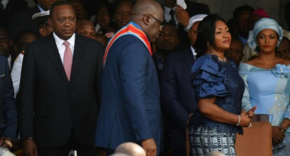 Kenya's Uhuru Kenyatta, seen next to Felix Tshisekedi at the latter's inauguration last month, offered to share lessons learned from his own country's past political tensions as Tshisekedi looks to forge DR Congo's future after his disputed poll win.  By TONY KARUMBA AFP