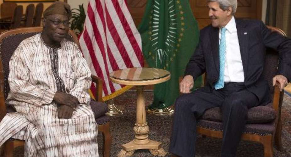 US Secretary of State John Kerry R meets with Olusegun Obasanjo, chairman of the African Union's South Sudan Commission of Inquiry, in Addis Ababa on May 2, 2014.  By Saul Loeb PoolAFP
