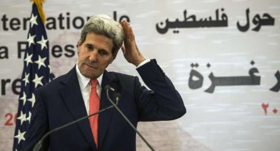 US Secretary of State John Kerry gestures as he arrives to take part in a press conference as part of the Gaza Donor Conference in Cairo on October 12, 2014.  By Khaled Desouki AFP