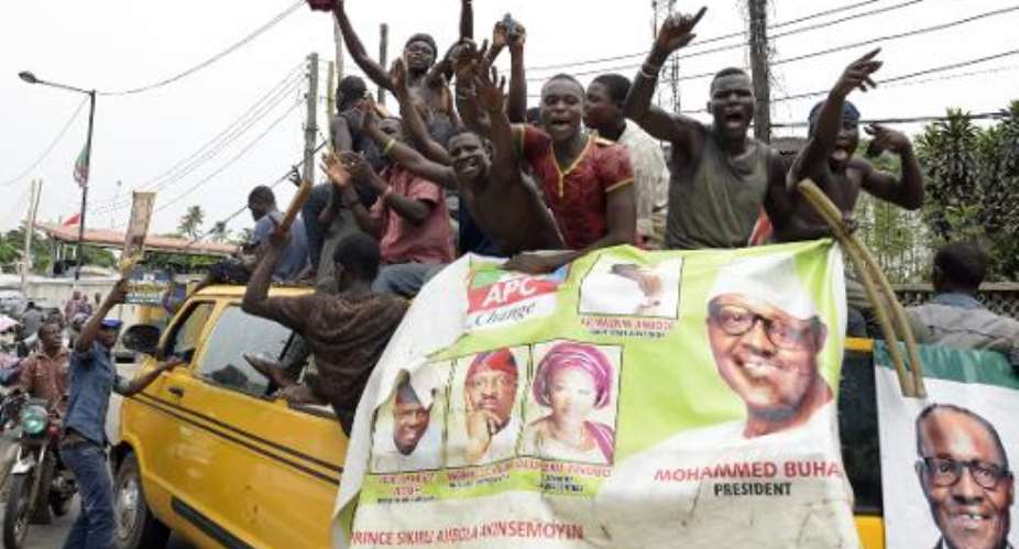 Supporters of Muhammadu Buhari celebrate his victory in Lagos on April 1, 2015.  By Pius Utomi Ekpei AFP